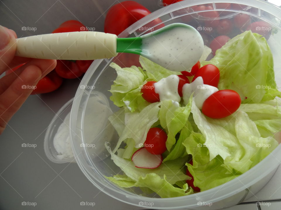 healthy breakfast full of vitamins - fresh salad with yogurt