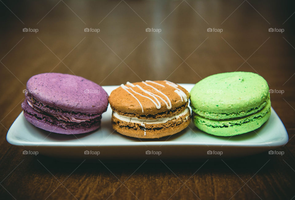 Multi colored macaroons on tray