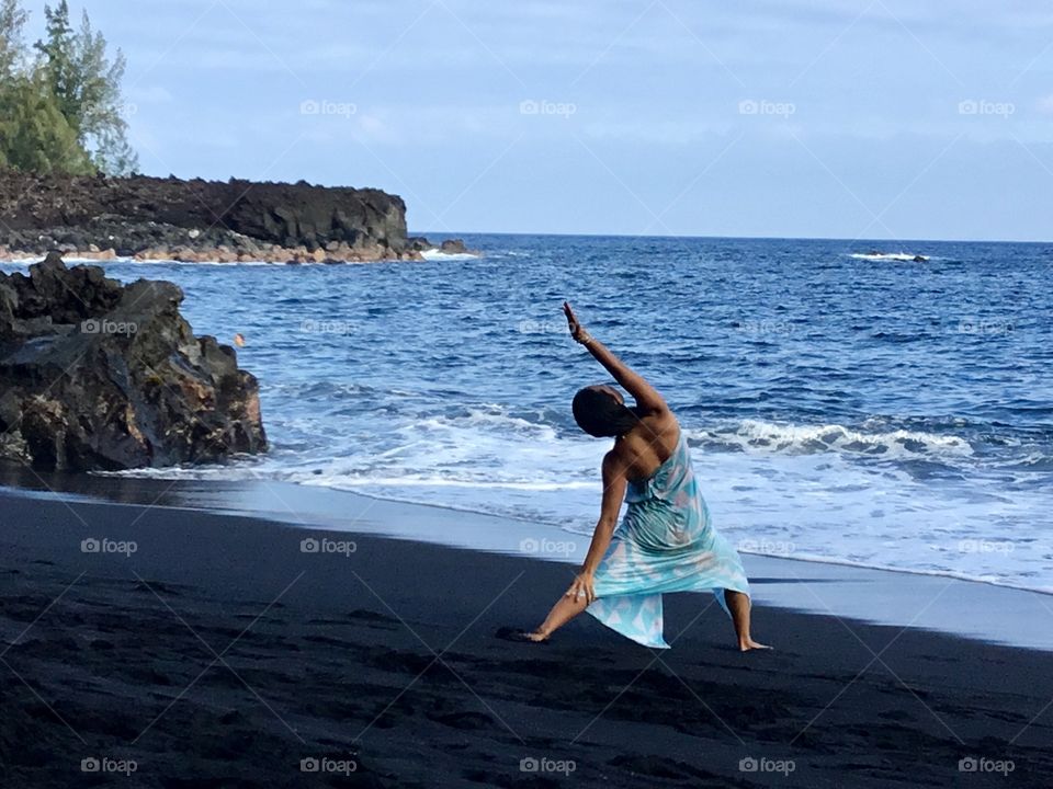 Yoga on the black sand