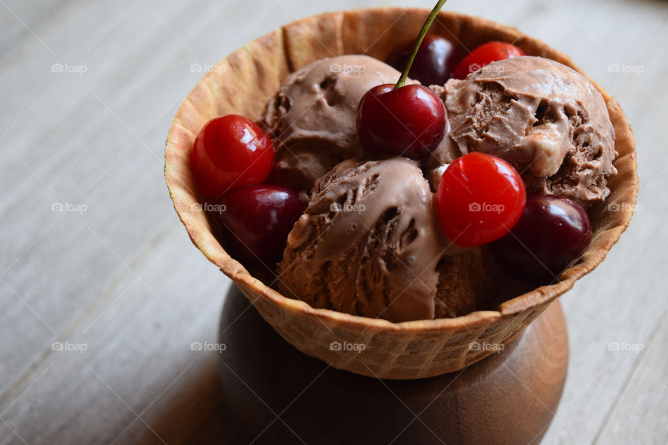 Close-up of cherries on ice cream