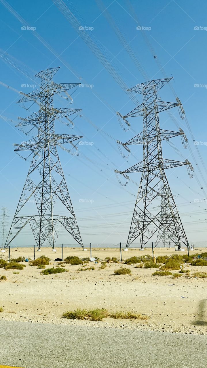 Desert view . Electric towers 