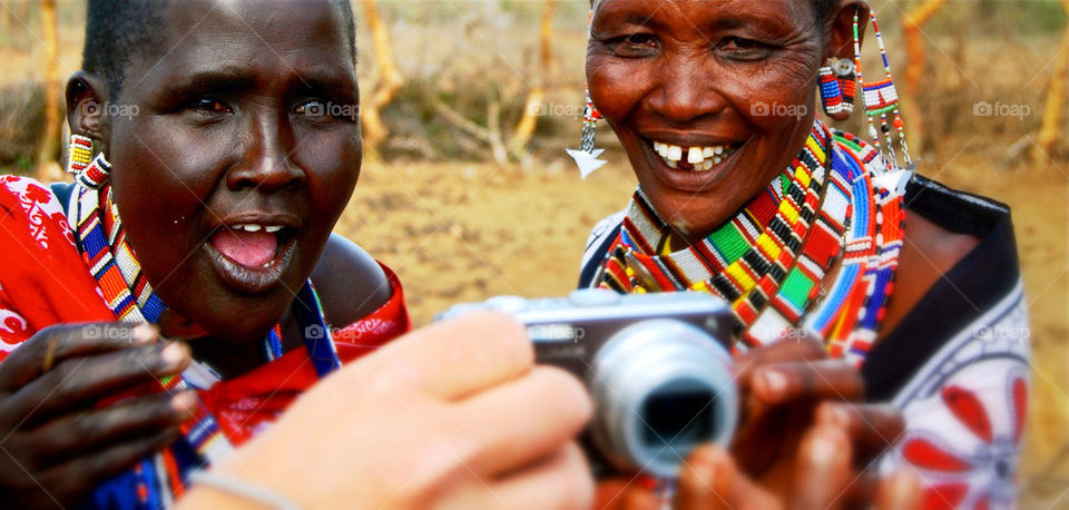 Kenya Women looking at there photo.