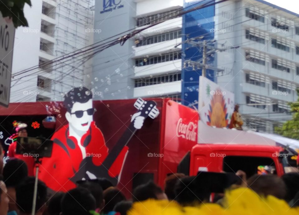 Coca-Cola float showcasing Elvis Presley theme at Sinulog Festival parade in Cebu.