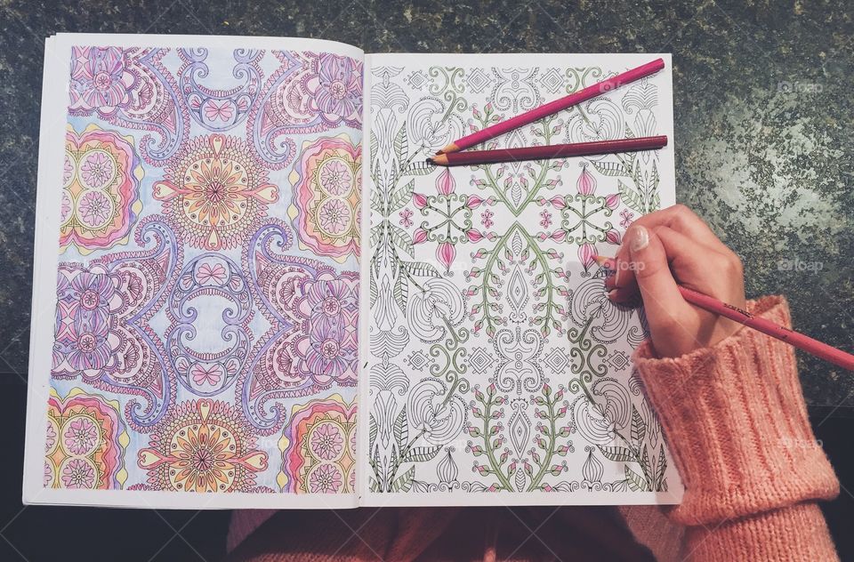 Coloring in a coloring book for relaxation