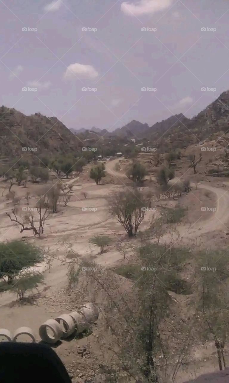 Glory be to God, the magnificent and picturesque view and the natural green trees are a view that is nothing more wonderful than it