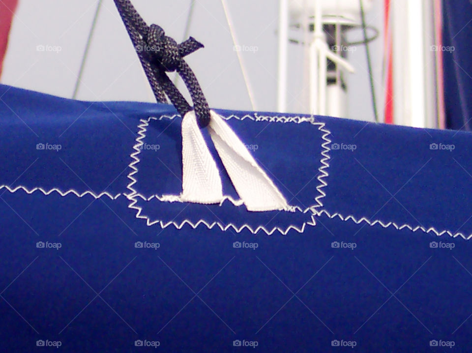 One triangular binding small rope on sail textile functional protection area with some details