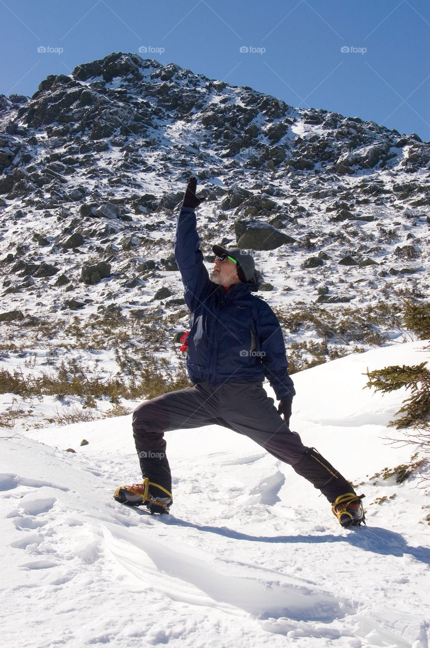 Man doing yoga on the summits of the presidential Range in the White