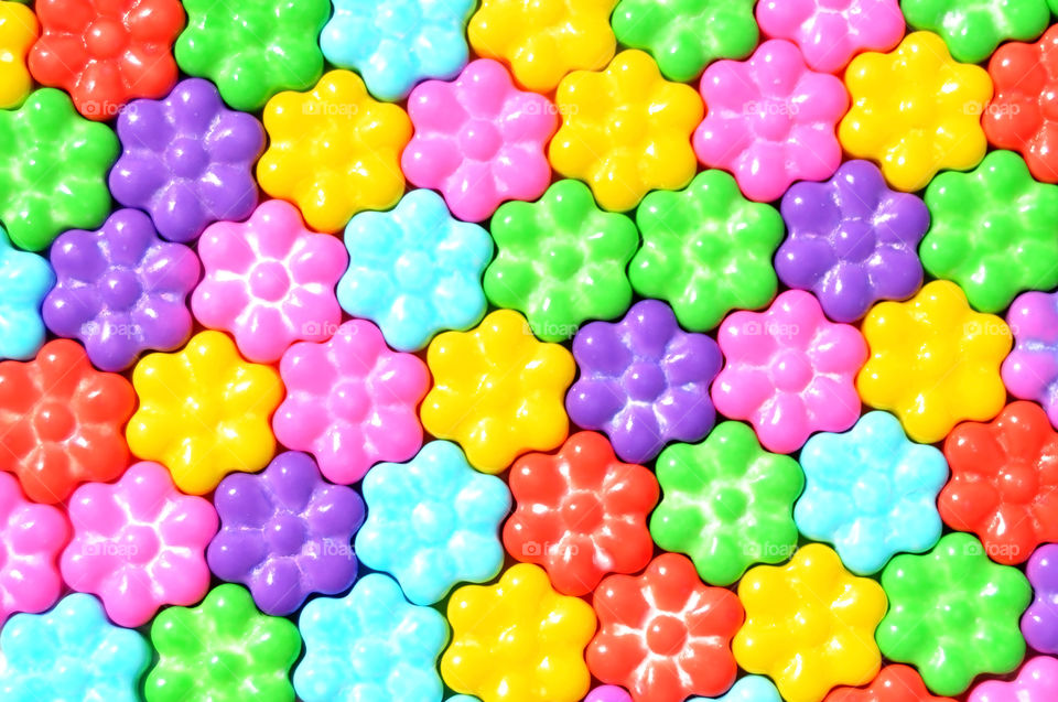 Colorful candies laid out to make a pretty pattern. Useful as a background texture.