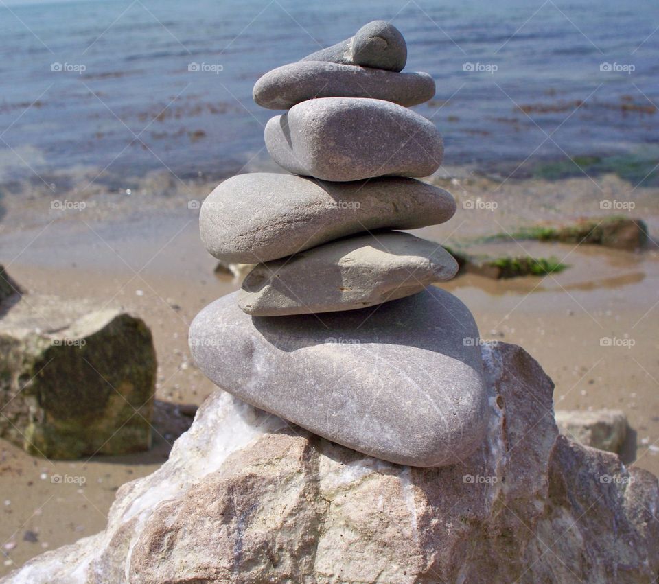 beautiful rock and pebble stack near the sea