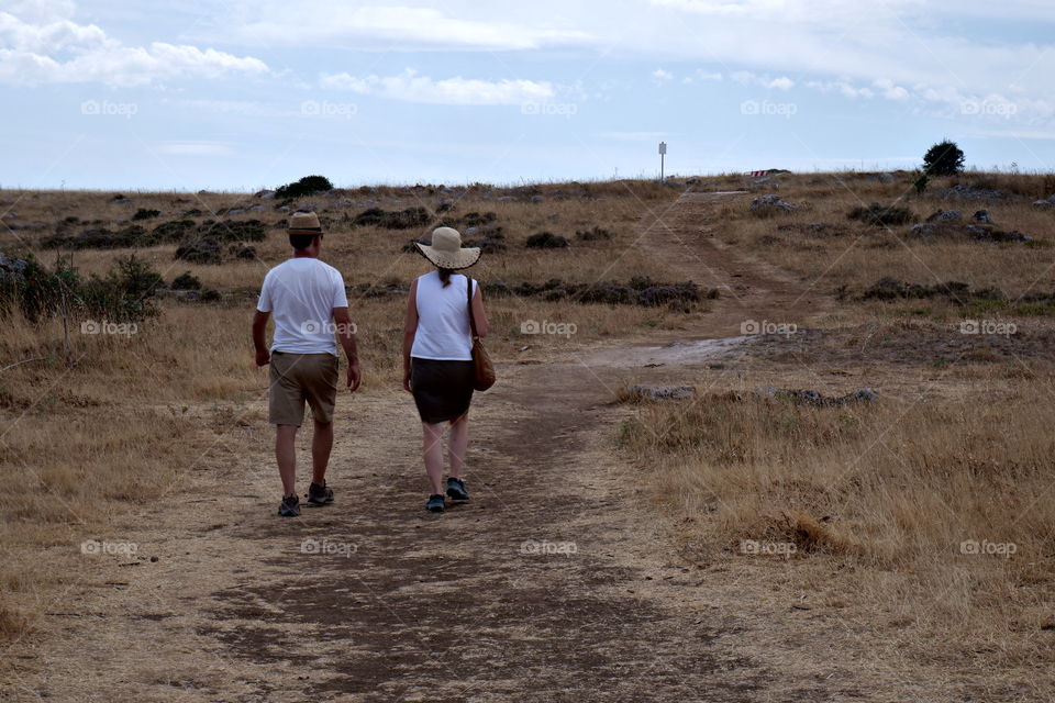 Two people going for a walk through the countryside 