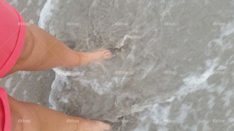 big feet in the water at Myrtle Beach