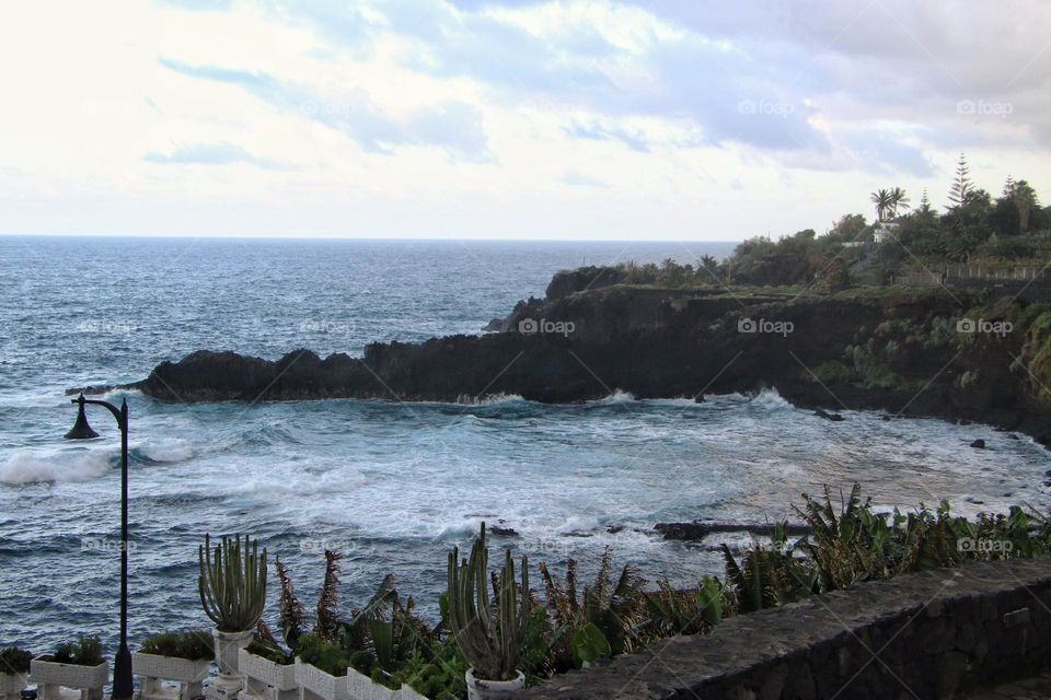 View over the atlantic ocean and a promenade with plants