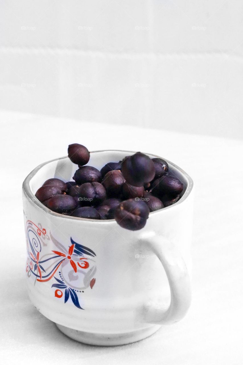 coffee beans in a cup with monochromatic