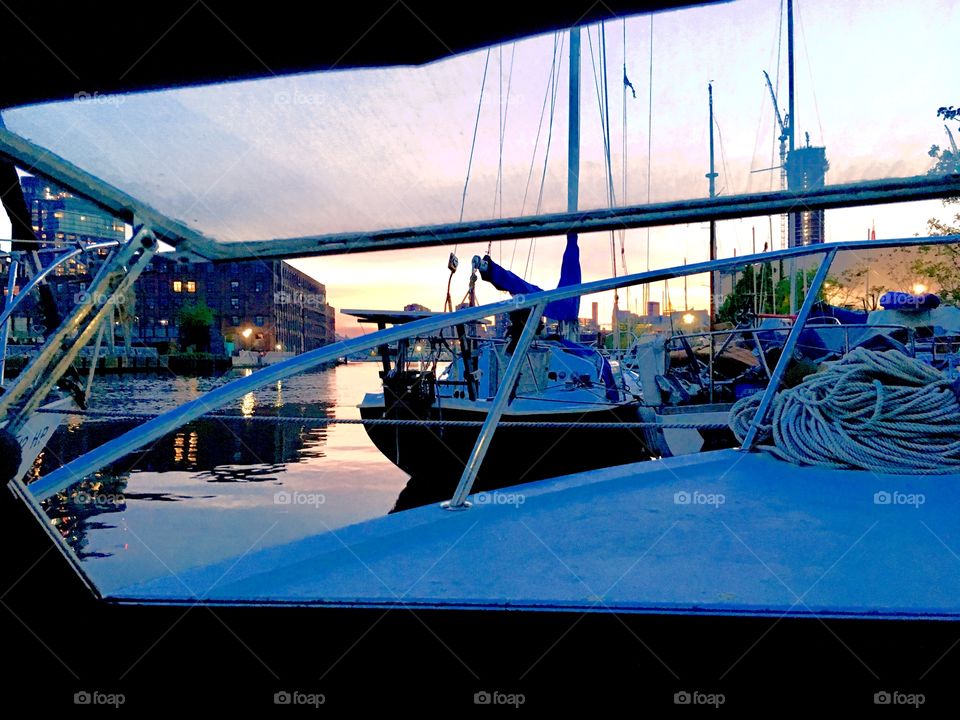 Sunset over the boats in Newtown Creek in Long Island City, Queens, NY as seen from inside our vessel, the “Salvation”. This picture was taken in the Spring of 2019. Hypnotic Productions