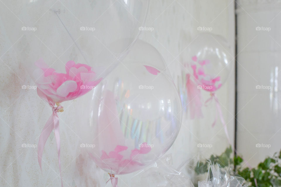 Heart shaped balloons hanging on wall. Perfect decorations for wedding and birthdays. 