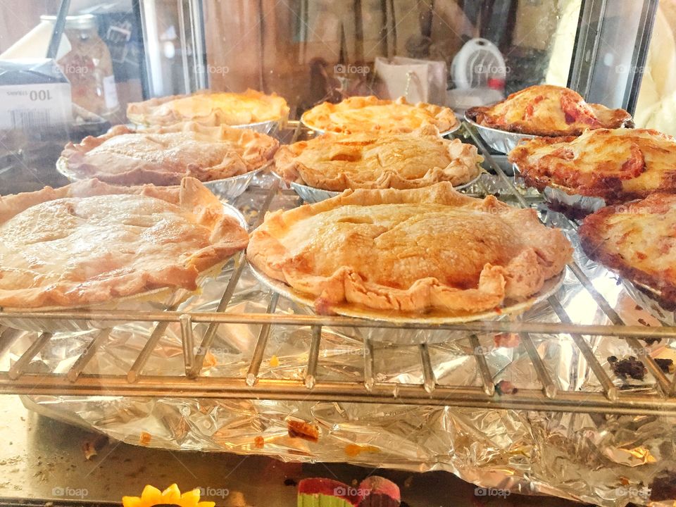 Fresh baked homemade pies cooling on a rack
