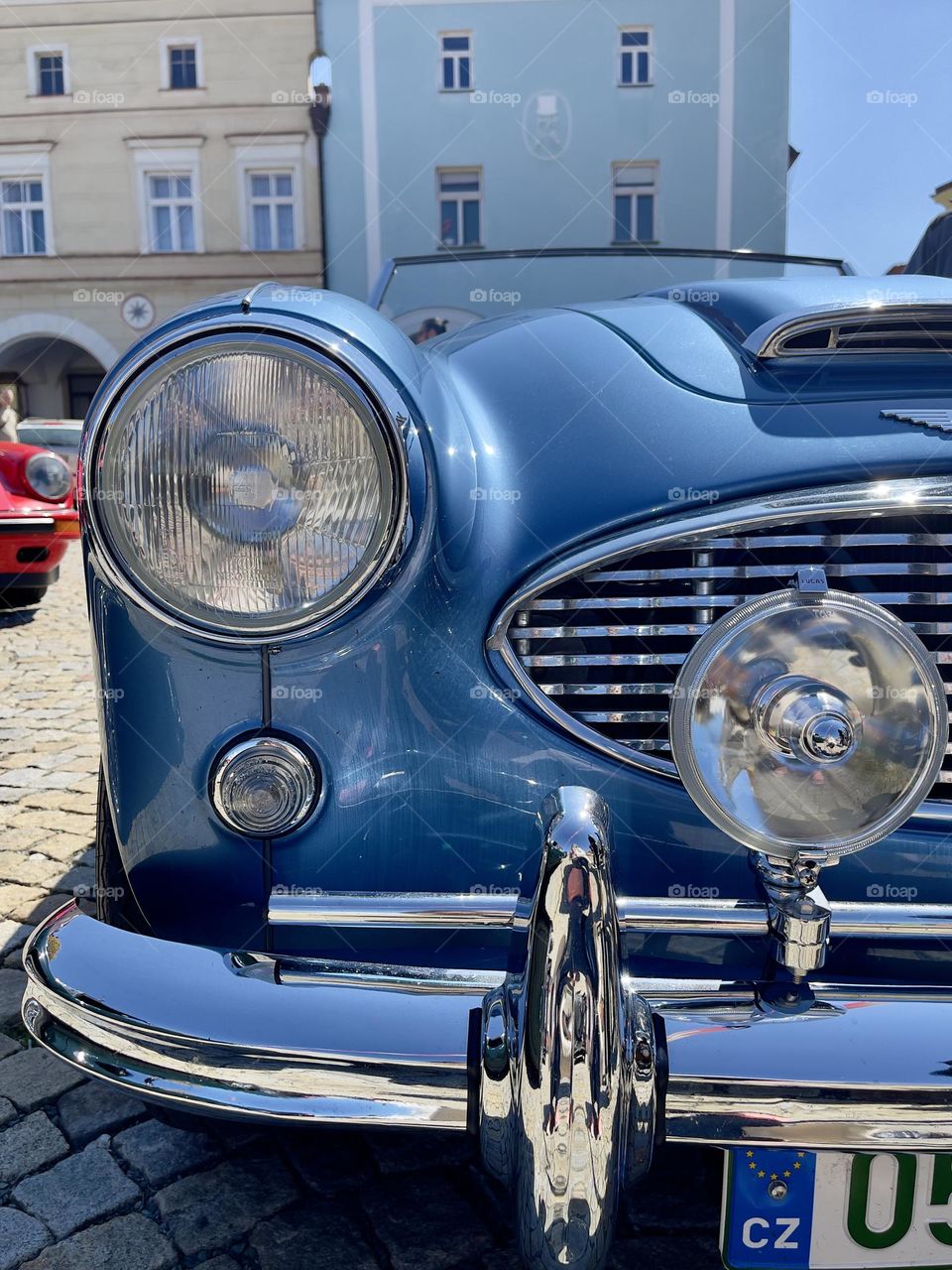 Headlights of blue retro car closeup
