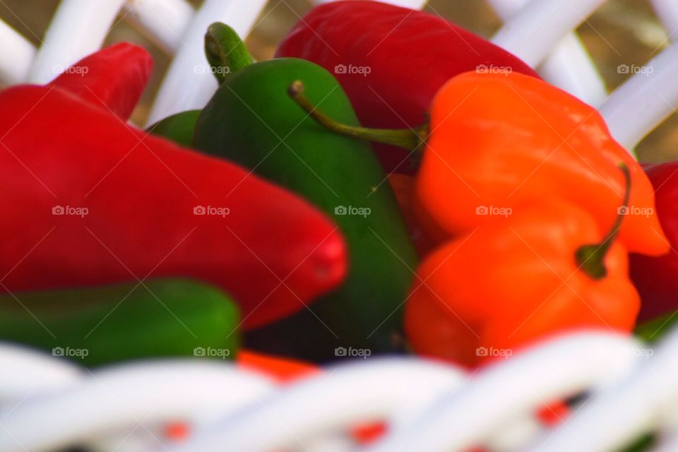 Basket of colorful hot chili peppers