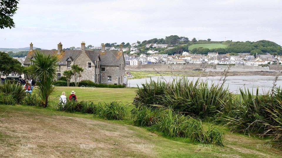Old house with small village on background 