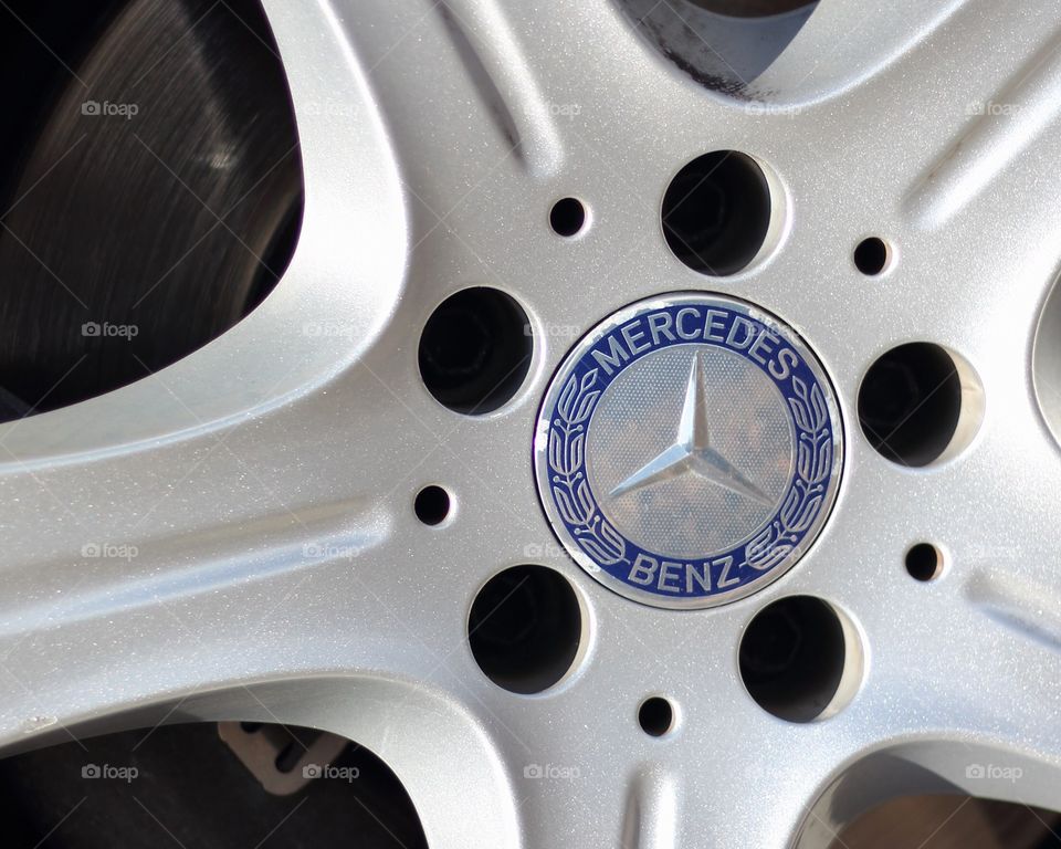 ed color Mercedes car end it’s logo on car wheel