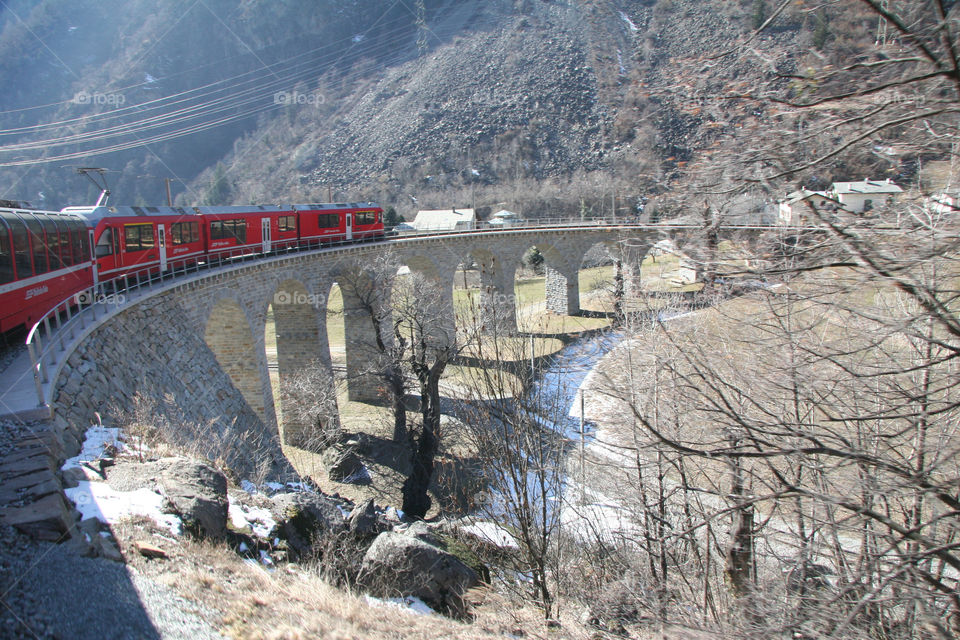 Bernina Express in Winter. The Rhätische Bahn Bernina Express panoramic train, from Chur in Switzerland to Tirano in Italy, is the highest mountain railway in the Alps.

The section between Thusis and Tirano is even an UNESCO World Heritage Site.