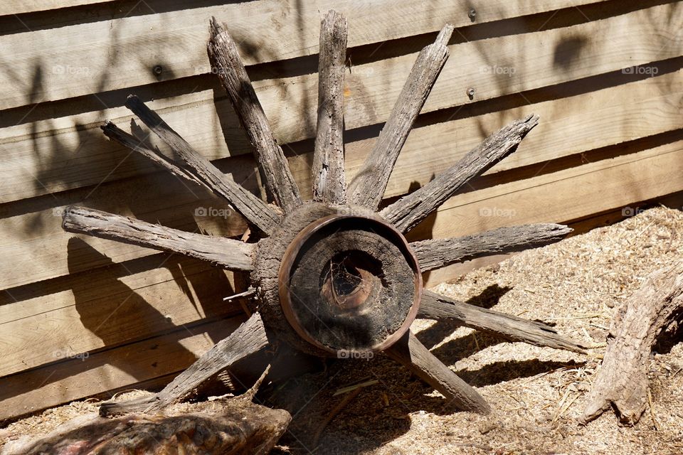 Decaying wooden wagon wheel