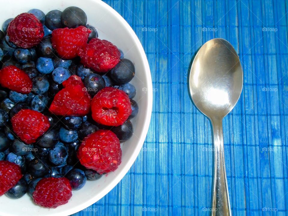 Raspberries and blueberries bowl
