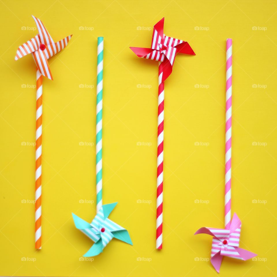 Yellow background with colorful pinwheels