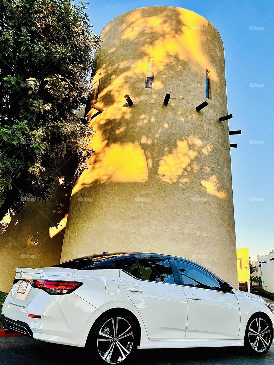 Black and White Nissan Sentra SR with Tower