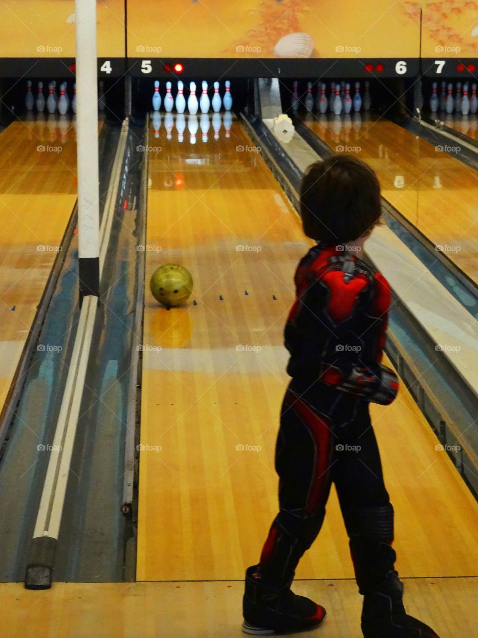 Young Boy Bowling
