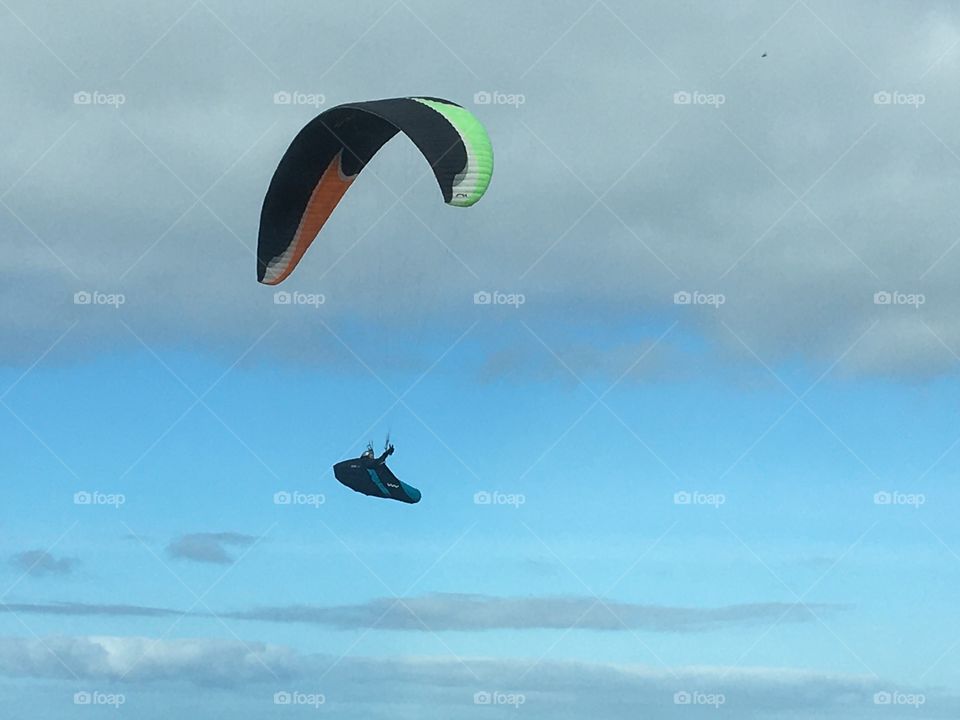 A paraglider enjoying a flight along the beach at Saltburn 