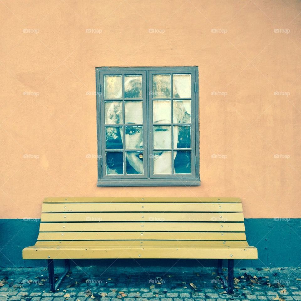 A bench and window