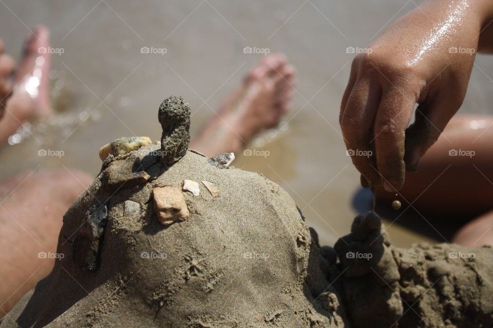 At the beach. Hand & feet