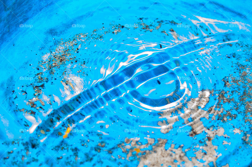 Surface water waves.Beautiful waves on the surface.Under water sand gravel stone elements.