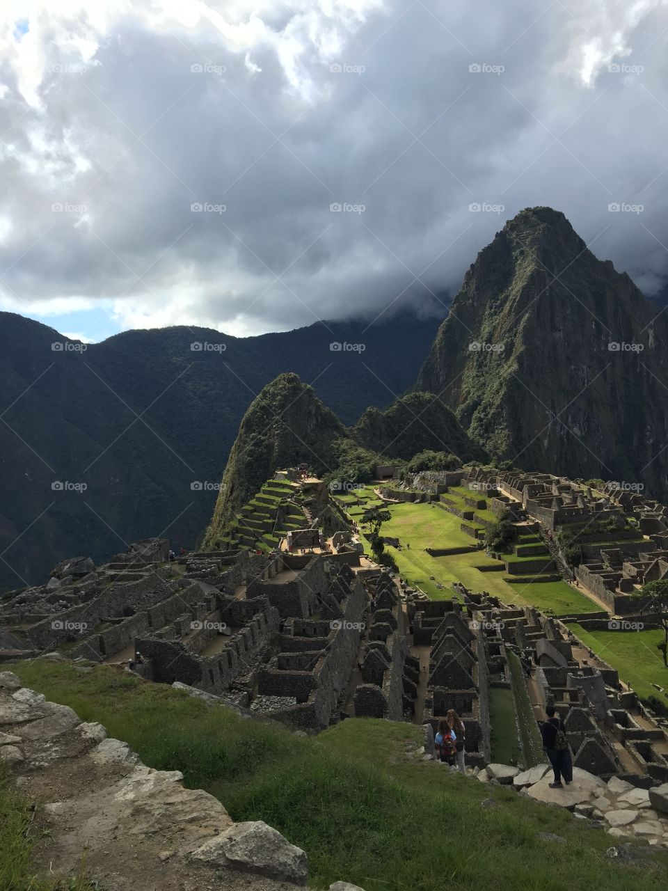 Choice lighting . The sun shines selectively on the beautiful hilltop city of Machu Picchu