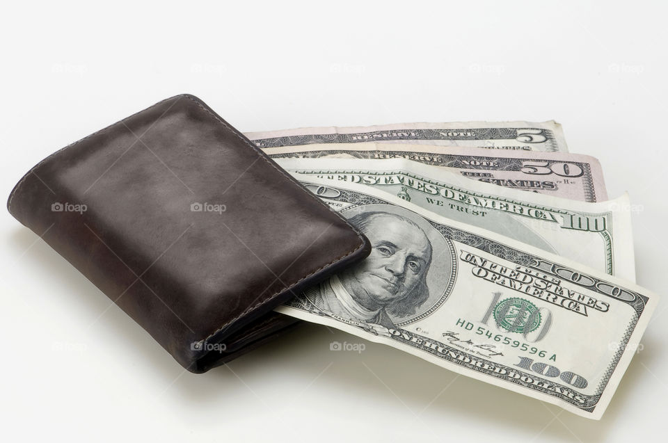 Us Dollars and wallet on White background