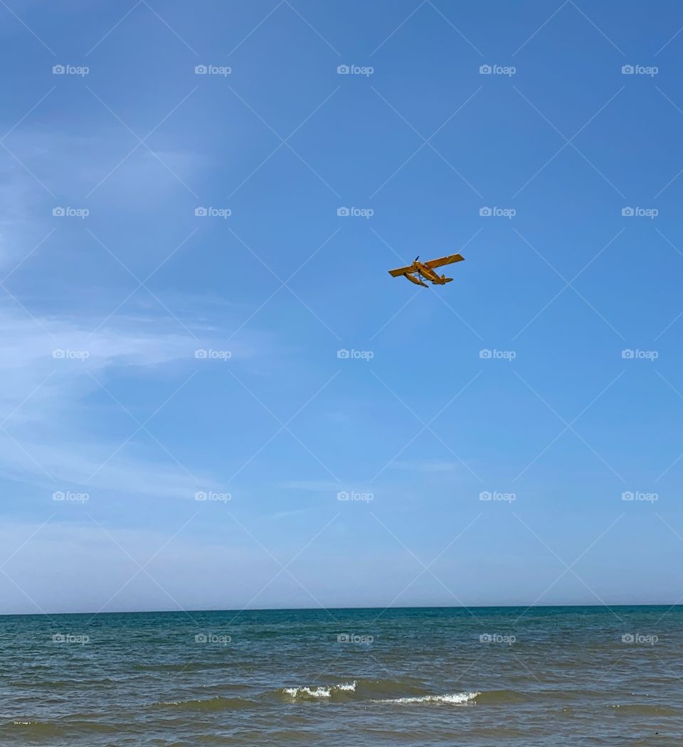 A plane flying over Lake Michigan—taken in Ludington, Michigan 