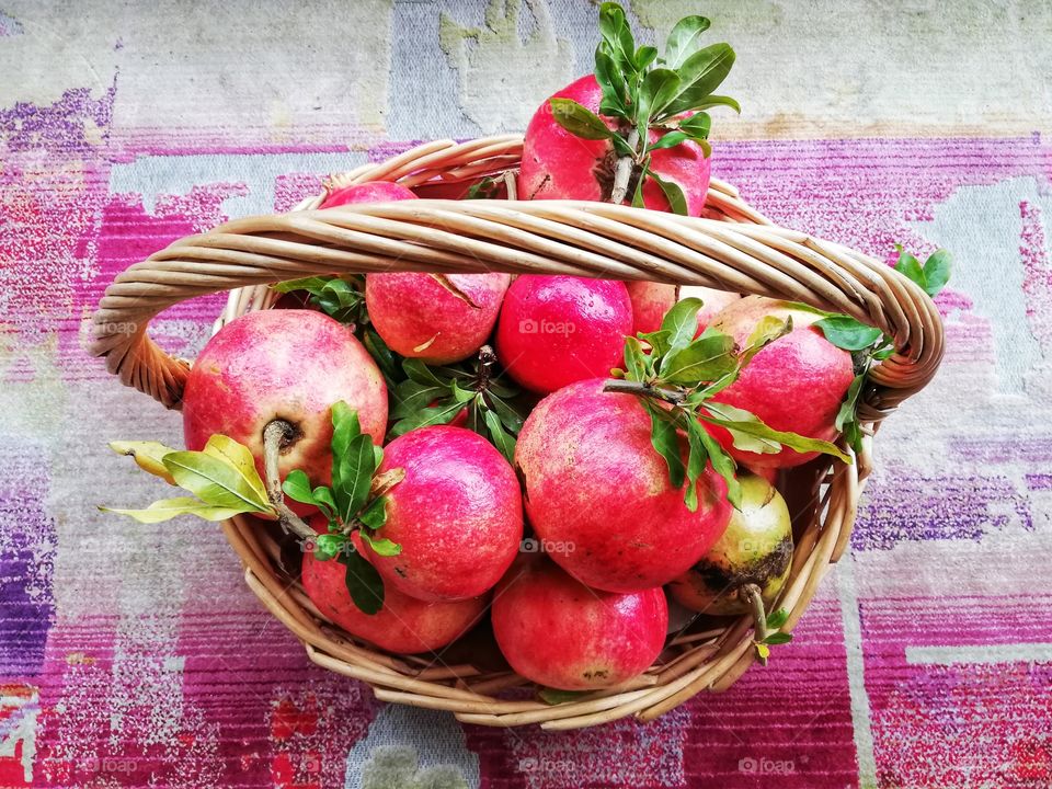 Basket with large red pomegranates