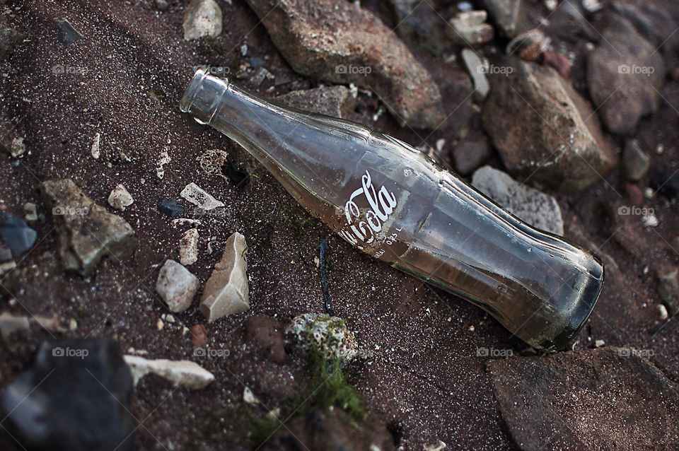 beach empty stone bottle by selecshine