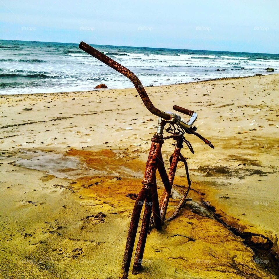 Lonely bicycle on the beach.  Montauk Beach. clear sky sandy beach