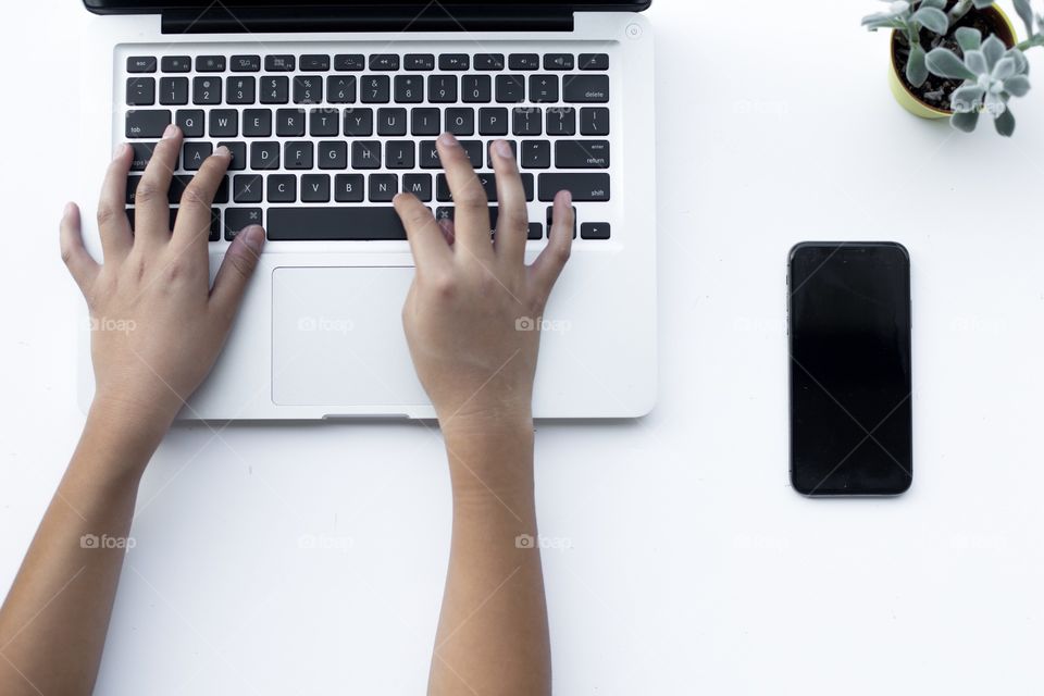 Girl typing on laptop 