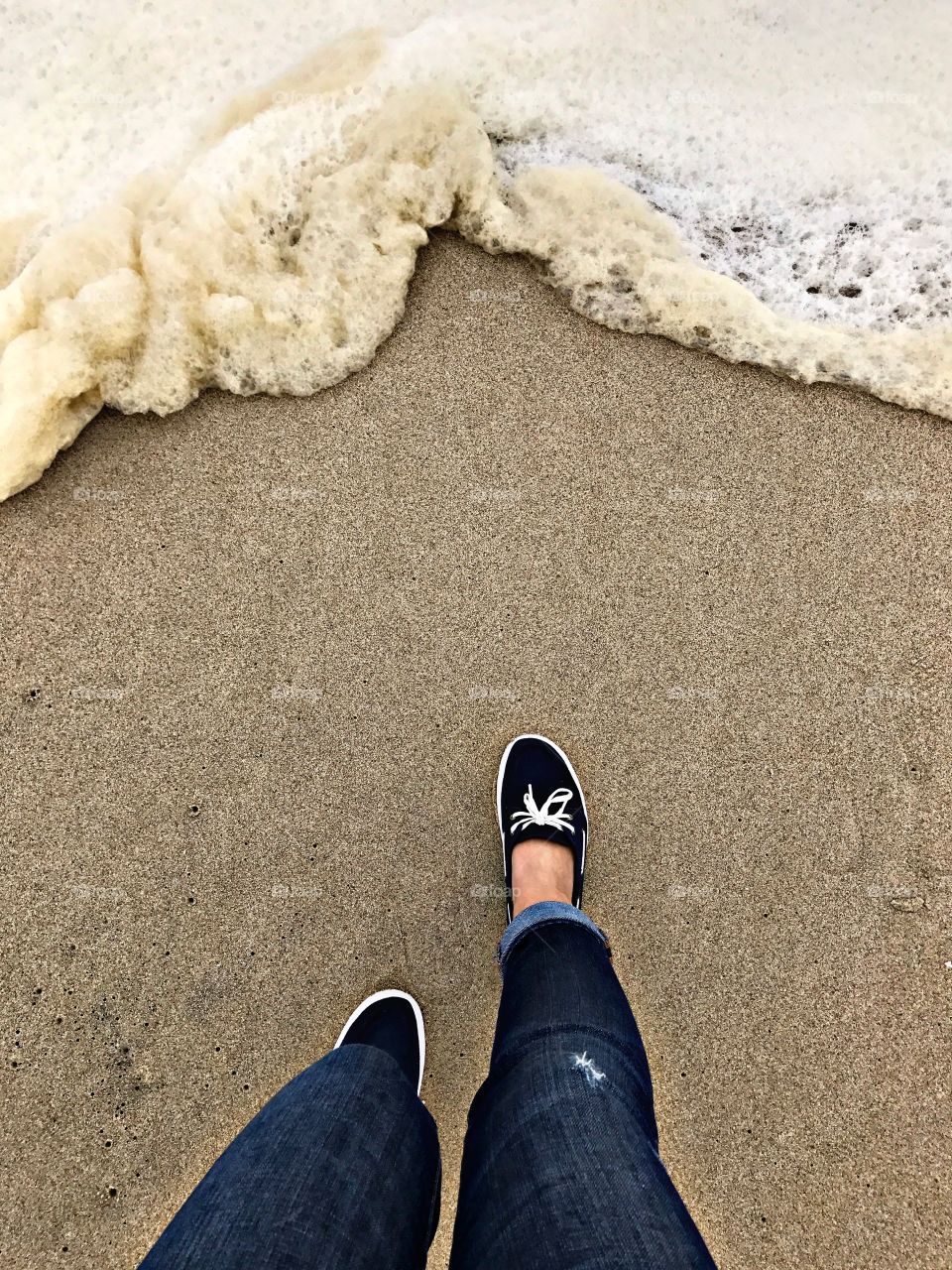 Stepping into sea foam. 