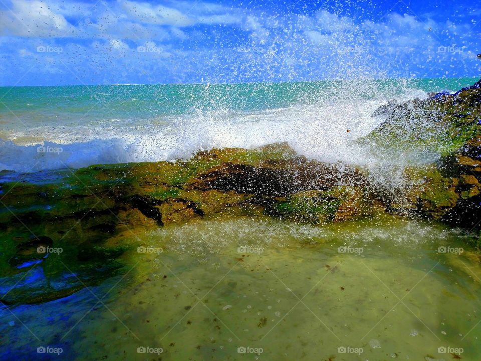 Wave splashing on rock