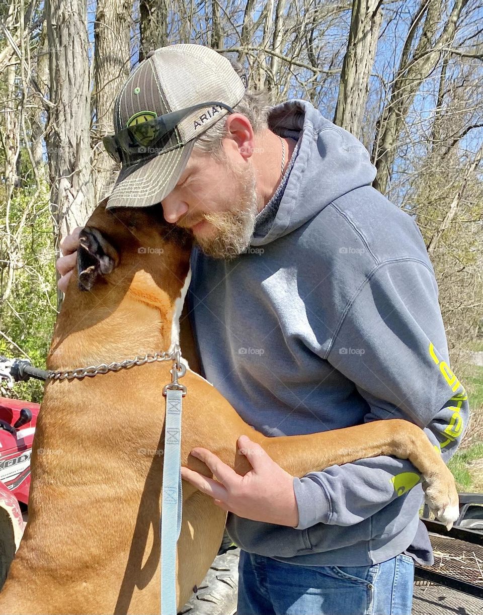 Man hugging his dog