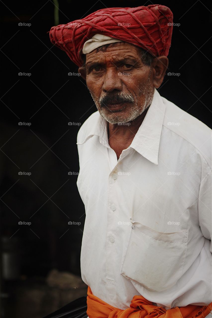 "At the end of the day, the face we have the courage to still be standing is enough of a reason to be happy and celebrate".
This portrait is of Bhau Vitthal Rao. He is resident of Singhad Fort, Pune India and he is one person who knows the complete story of Sivaji bravery and Maratha war in times of Mughal empire in india. Bhau is a determined and strong willed person with a shine in eyes and always singing songs of bravery and winning. Positive thoughts and strong determination is part of his nature. ( Model Release - available and provided on request). #FOAPNATION @doondevil
