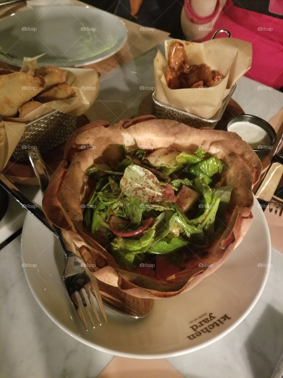 Fattoush is a Levantine bread salad made from toasted or fried pieces of Arabic flat bread combined with mixed greens and other vegetables, such as radishes and tomatoes. Lebanese Food is a must try