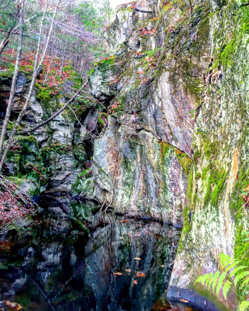 Cliff wall and water