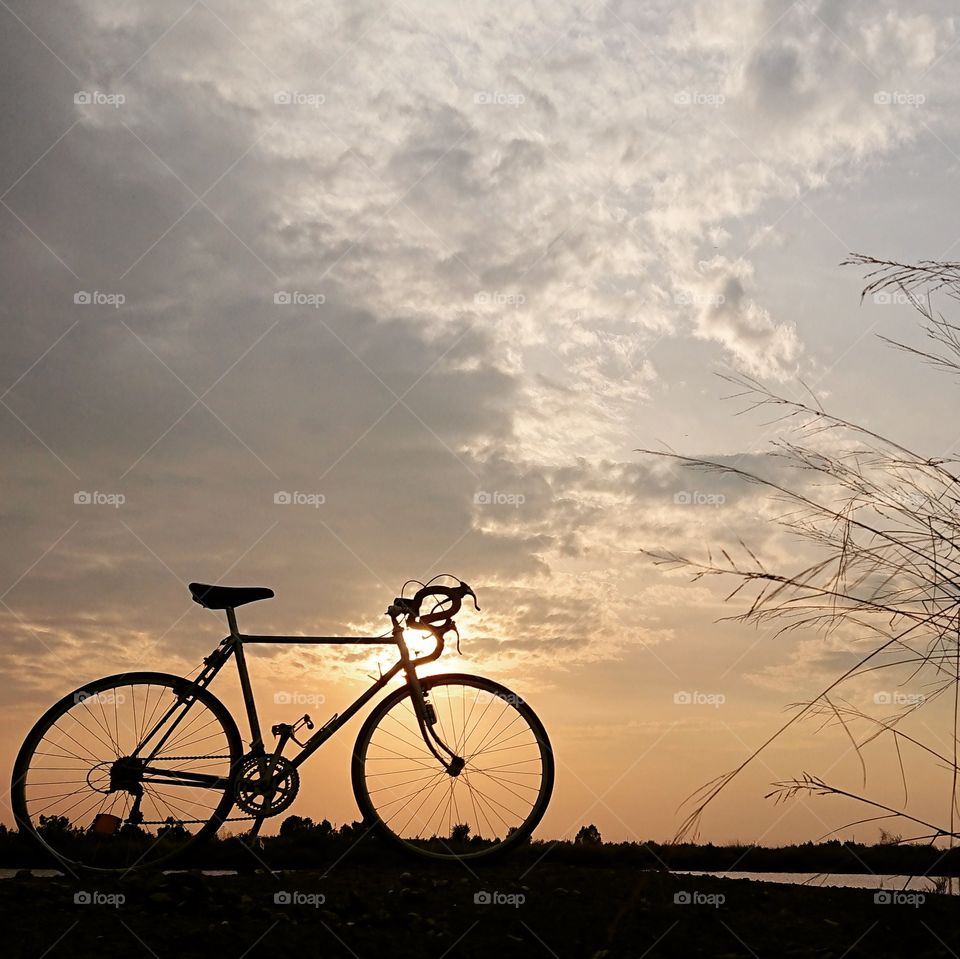 Vintage bicycle, and ​sunset