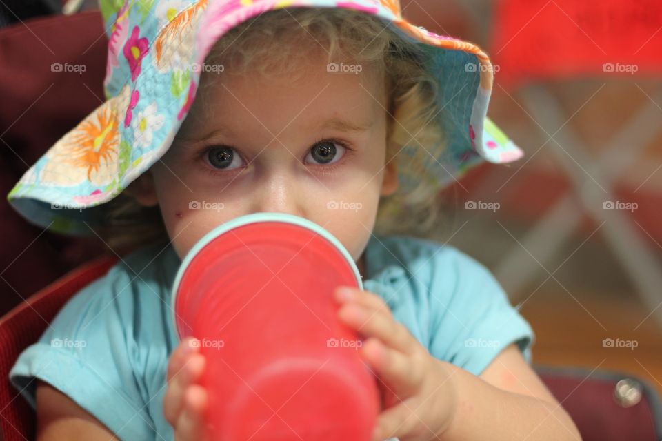 Little girl drinking water 