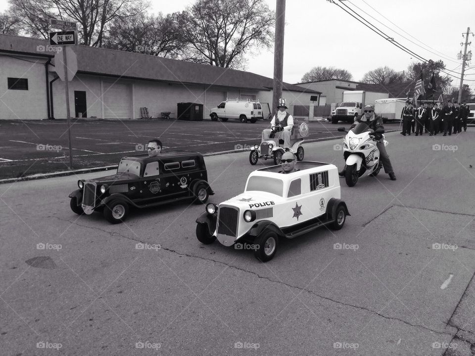 Many cars in a parade